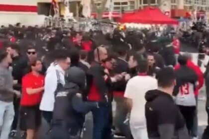 Policías y aficionados del Benfica se enfrentan frente al Bernabéu